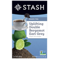 Stash tea package with a cup of tea, lime, and bergamot on a blue background