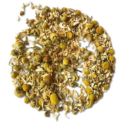 Dried chamomile tea loose leaves and yellow flower heads arranged in a circular pile on a white background.