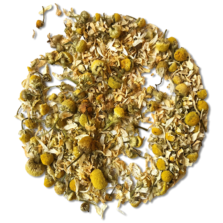 Dried chamomile tea loose leaves and yellow flower heads arranged in a circular pile on a white background.