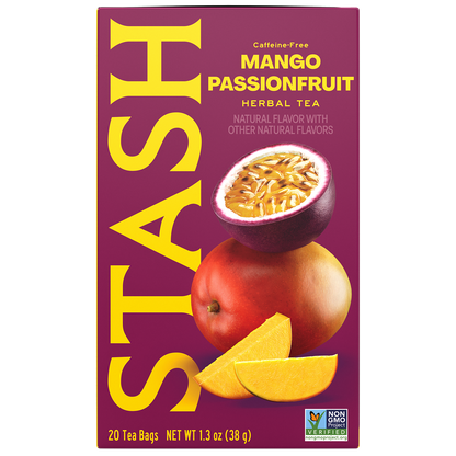 A box of Stash Caffe-Free Mango Passionfruit Herbal Tea. The packaging features a deep magenta background with large yellow 'STASH' branding, an illustration of a sliced passionfruit, a whole mango, and two mango slices.