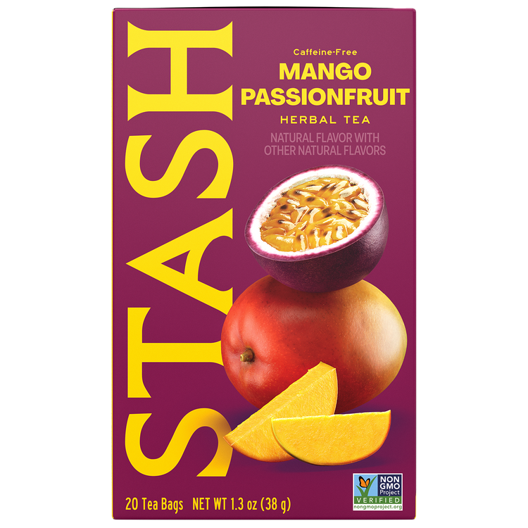A box of Stash Caffe-Free Mango Passionfruit Herbal Tea. The packaging features a deep magenta background with large yellow 'STASH' branding, an illustration of a sliced passionfruit, a whole mango, and two mango slices.