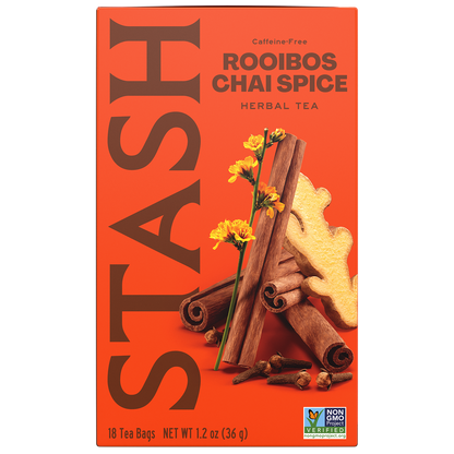 A box of Stash Rooibos Chai Spice herbal tea. The packaging is bright orange with large brown 'STASH' lettering, and an illustration of cinnamon sticks, ginger root, and yellow flowers.
