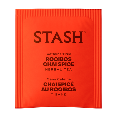 A single red-orange foil tea packet from the brand STASH, labeled 'Caffeine-Free Rooibos Chai Spice Herbal Tea' in dark brown text, shown on a plain white background.