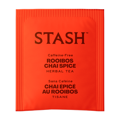 A single red-orange foil tea packet from the brand STASH, labeled 'Caffeine-Free Rooibos Chai Spice Herbal Tea' in dark brown text, shown on a plain white background.